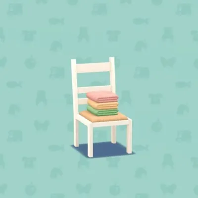 タオルのつまれたイスの画像