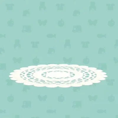 しろいレースあみのラグの画像